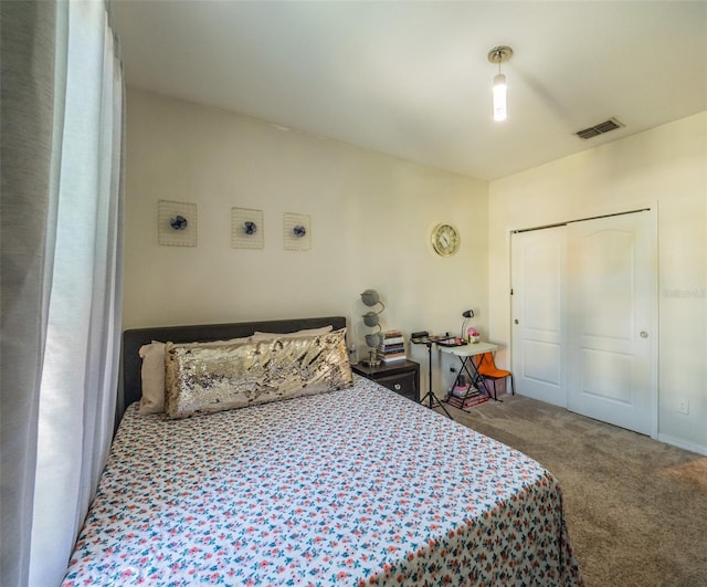 bedroom featuring carpet and a closet