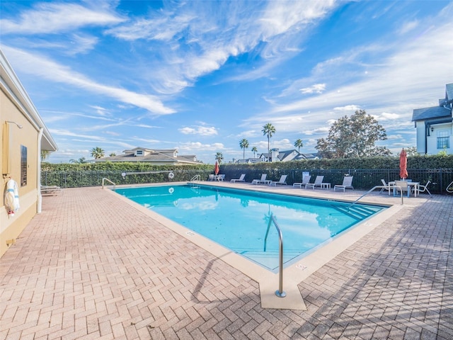 view of pool featuring a patio