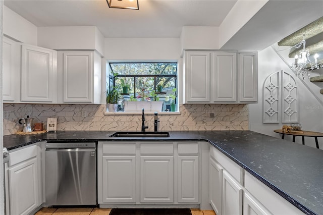 1254 Seminola Blvd, Casselberry, FL 32707 - kitchen featuring dishwasher, a sink, white cabinetry, and decorative backsplash