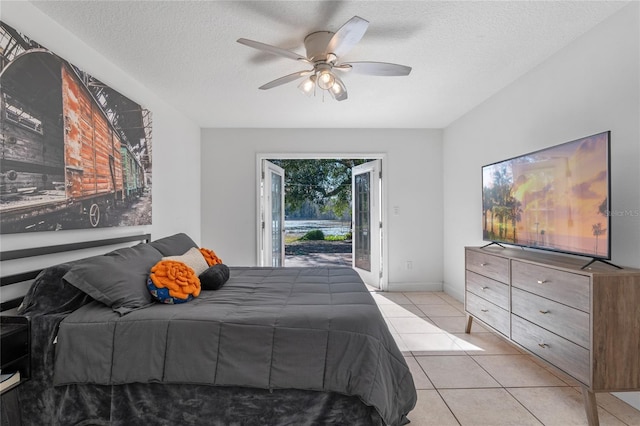 1254 Seminola Blvd, Casselberry, FL 32707 - bedroom with access to outside, a textured ceiling, light tile patterned flooring, and ceiling fan