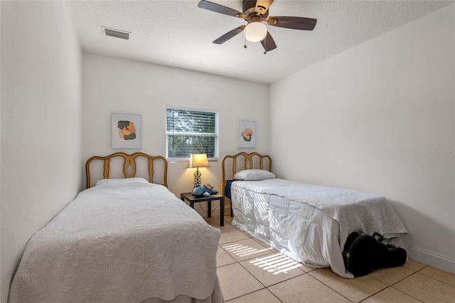 1254 Seminola Blvd, Casselberry, FL 32707 - bedroom featuring light tile patterned floors, a textured ceiling, and ceiling fan