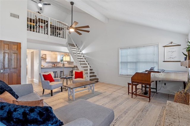 1254 Seminola Blvd, Casselberry, FL 32707 - tiled living room with stairs, ceiling fan, beam ceiling, and high vaulted ceiling