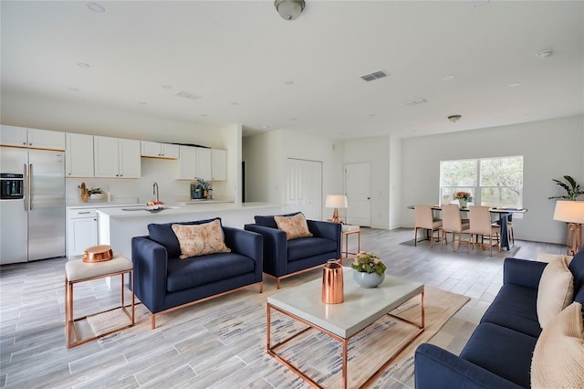 living room featuring sink