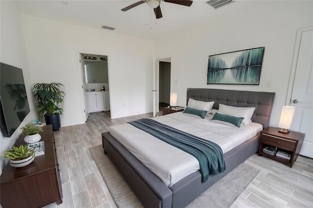 bedroom with ensuite bathroom and ceiling fan