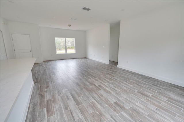 unfurnished living room with light hardwood / wood-style flooring