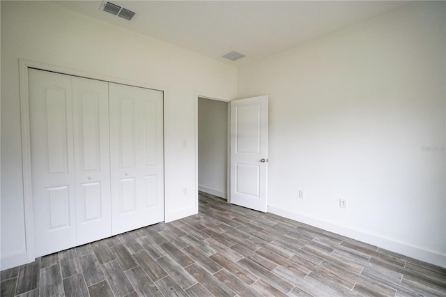 unfurnished bedroom with a closet