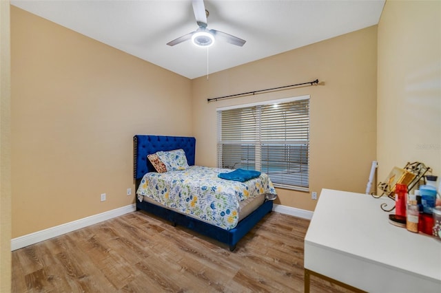 bedroom with hardwood / wood-style flooring and ceiling fan