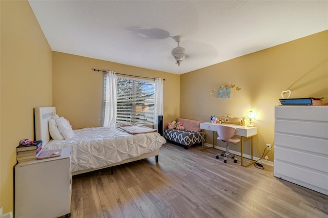 bedroom with hardwood / wood-style flooring and ceiling fan