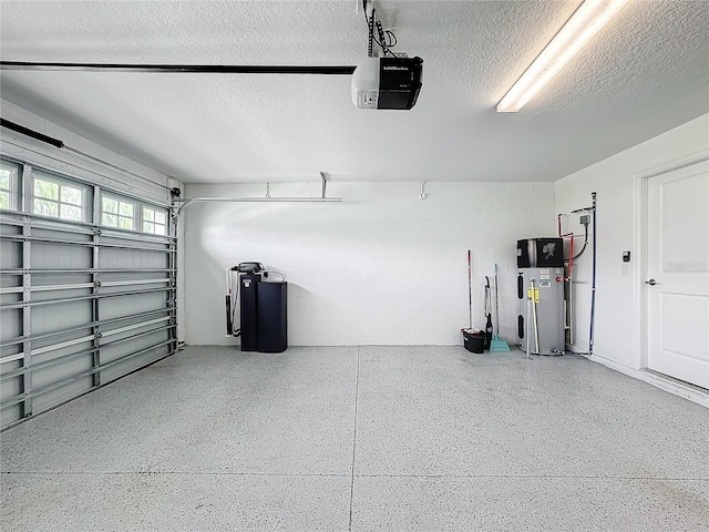 garage with heat pump water heater and a garage door opener