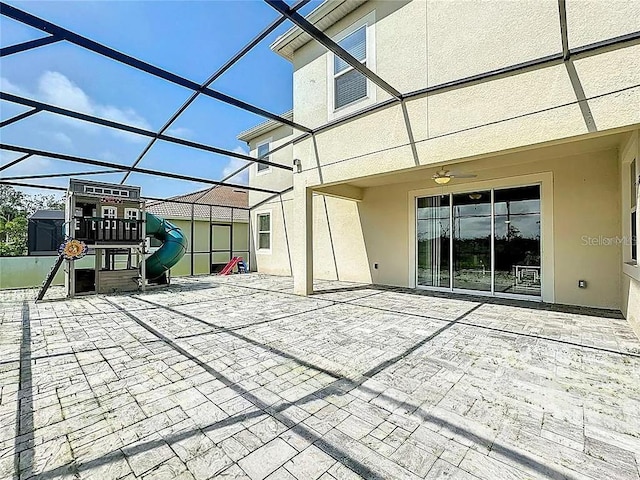 view of patio / terrace featuring a lanai and a playground