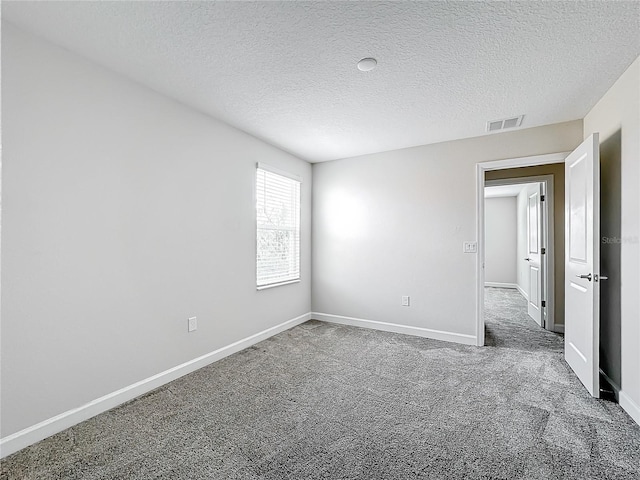 8886 Fallen Oak Dr, Davenport, FL 33896 - spare room featuring carpet flooring and a textured ceiling