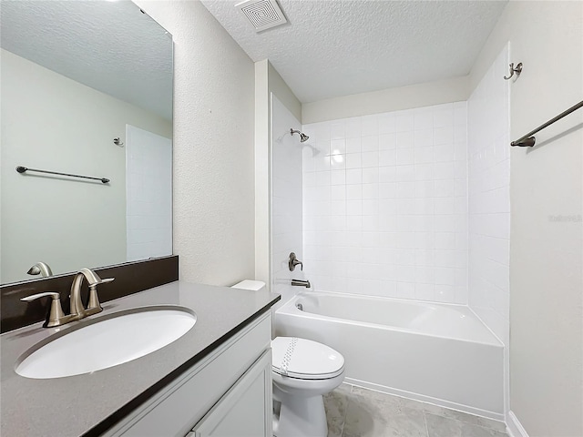 8886 Fallen Oak Dr, Davenport, FL 33896 - full bath featuring vanity, a textured ceiling, and shower / tub combination