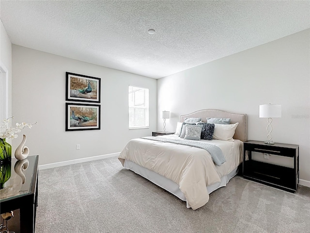 8886 Fallen Oak Dr, Davenport, FL 33896 - carpeted bedroom featuring a textured ceiling