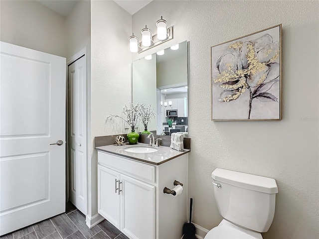 8886 Fallen Oak Dr, Davenport, FL 33896 - half bath featuring vanity and toilet