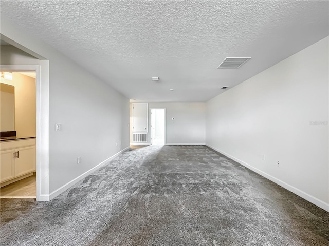8886 Fallen Oak Dr, Davenport, FL 33896 - empty room featuring carpet flooring and a textured ceiling