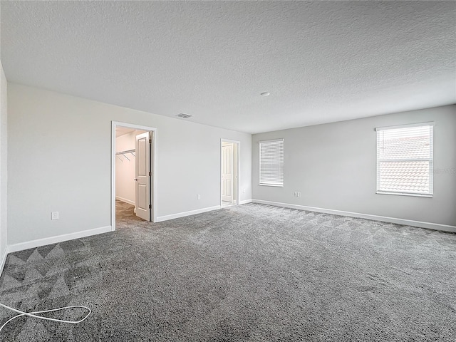 8886 Fallen Oak Dr, Davenport, FL 33896 - empty room with a textured ceiling and carpet flooring