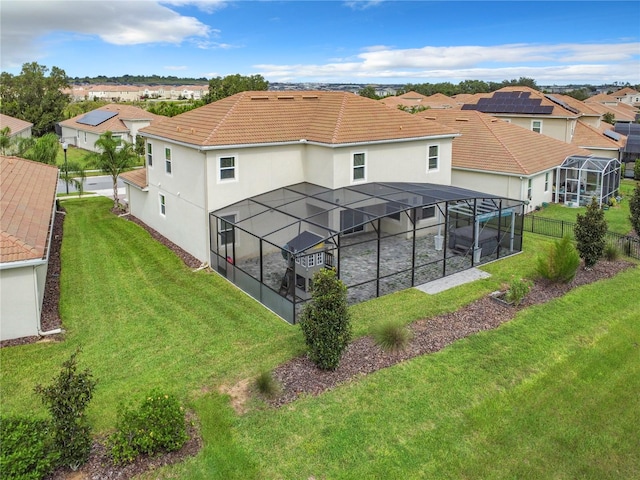 8886 Fallen Oak Dr, Davenport, FL 33896 - back of property featuring glass enclosure, stucco siding, a residential view, and a tiled roof