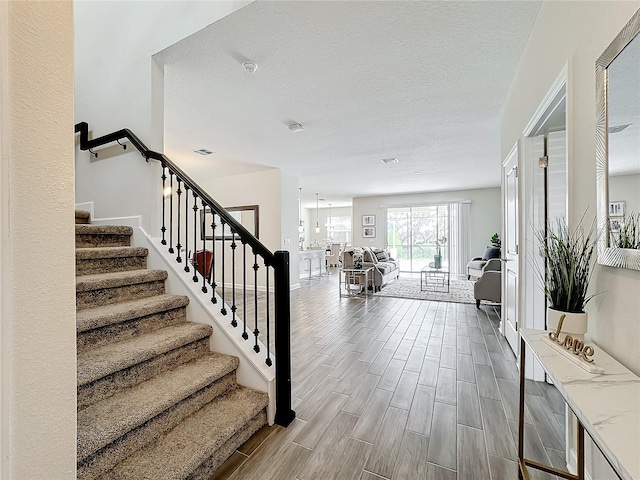 8886 Fallen Oak Dr, Davenport, FL 33896 - stairs featuring wood finished floors