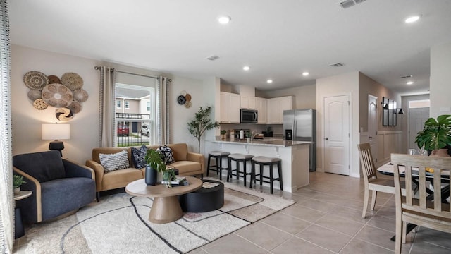 living room with light tile patterned floors