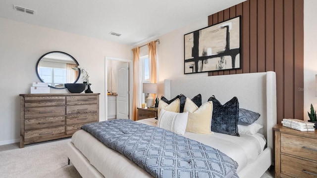 bedroom featuring light colored carpet