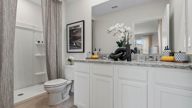 bathroom with a shower with curtain, toilet, tile patterned flooring, and vanity