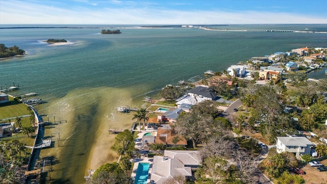 drone / aerial view featuring a residential view and a water view