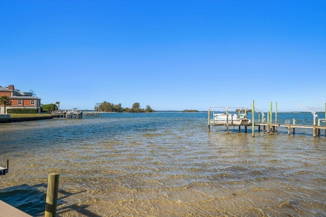 view of dock featuring a water view and boat lift