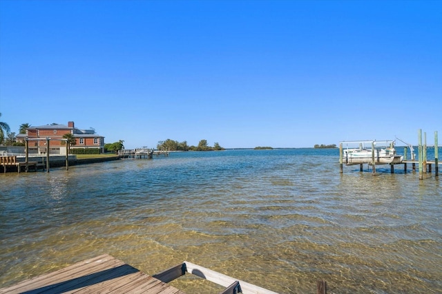 view of dock with a water view and boat lift