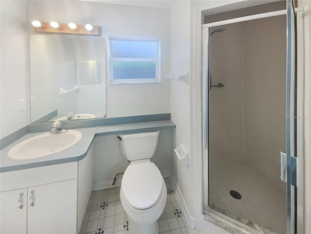 bathroom with vanity, walk in shower, and toilet