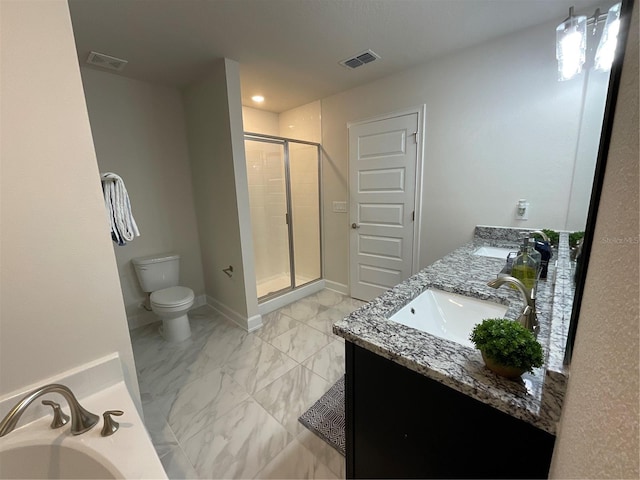 bathroom featuring vanity, toilet, and walk in shower