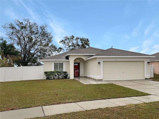 view of front facade with a garage and a front yard