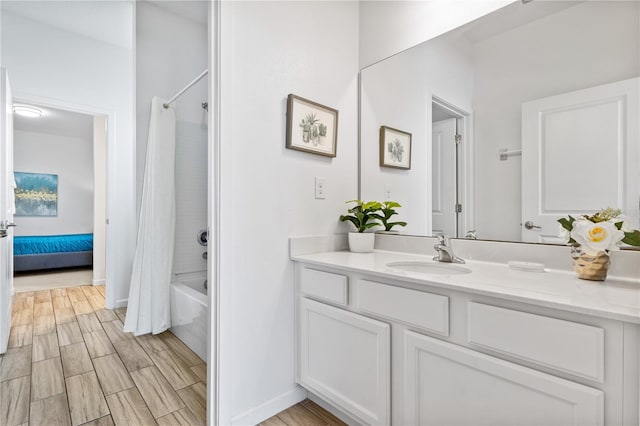 bathroom featuring vanity and shower / bathtub combination with curtain