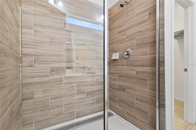 bathroom with a tile shower