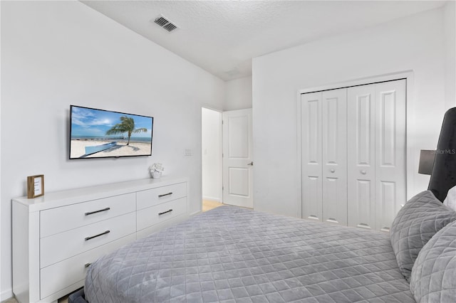 bedroom with a closet and a textured ceiling