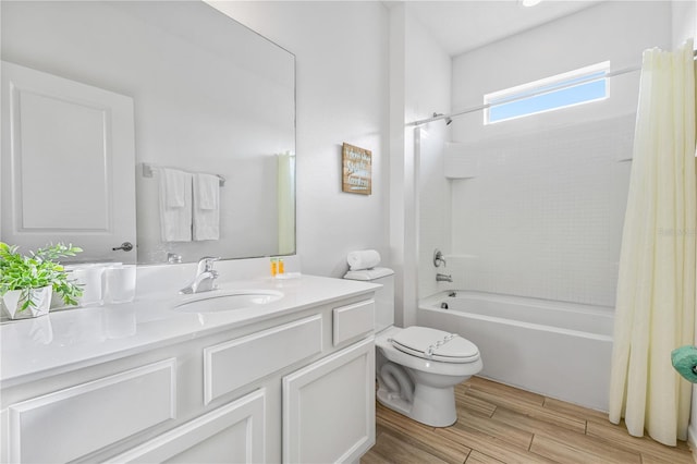 full bathroom featuring toilet, vanity, and shower / bath combination with curtain