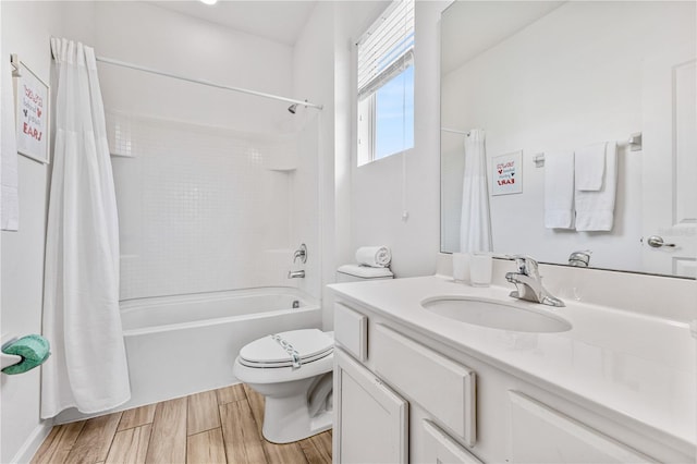 full bathroom featuring toilet, vanity, and shower / tub combo