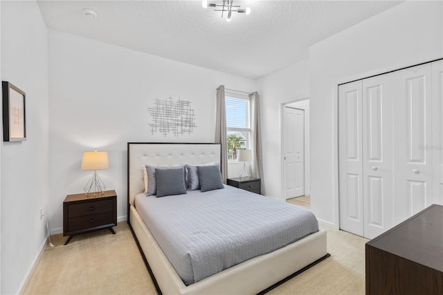 carpeted bedroom with a textured ceiling