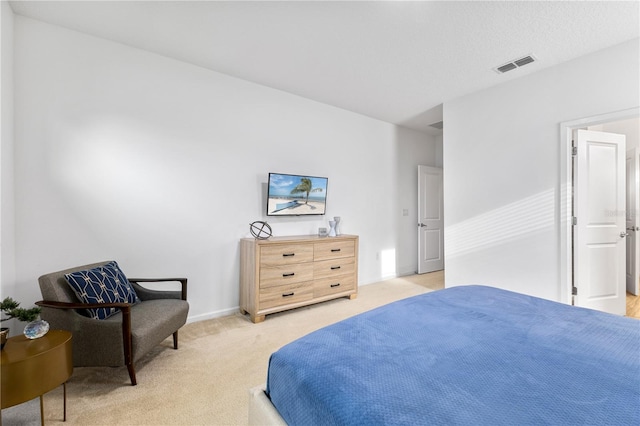 bedroom featuring light colored carpet