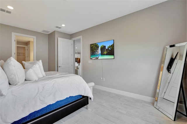 bedroom with light hardwood / wood-style floors