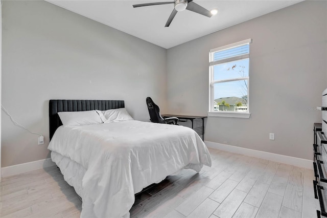 bedroom featuring light hardwood / wood-style flooring and ceiling fan