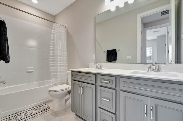 full bathroom with vanity, toilet, and shower / bath combo