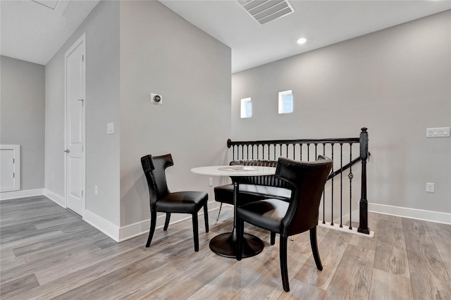 dining space featuring light wood-type flooring