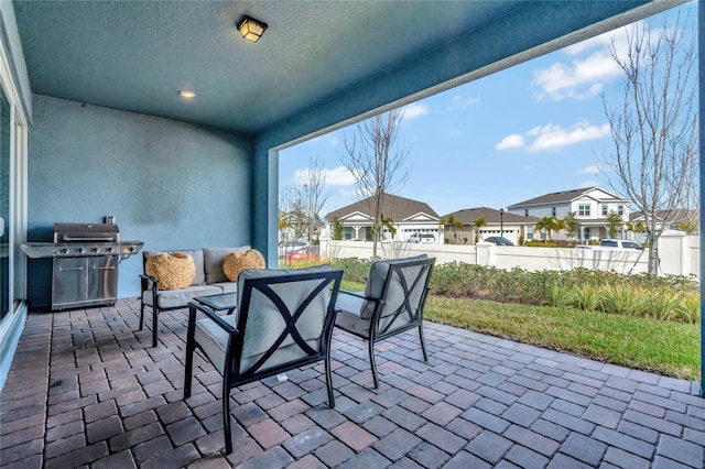 view of patio with an outdoor hangout area and grilling area