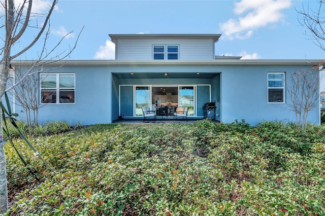 rear view of house with a patio area