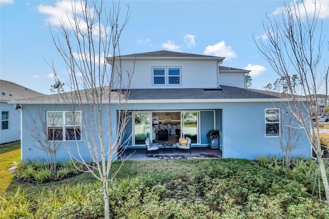 back of property with a patio area