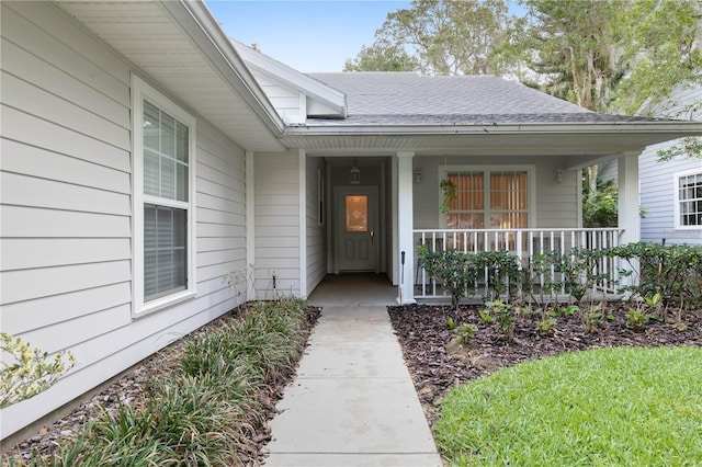 property entrance featuring covered porch