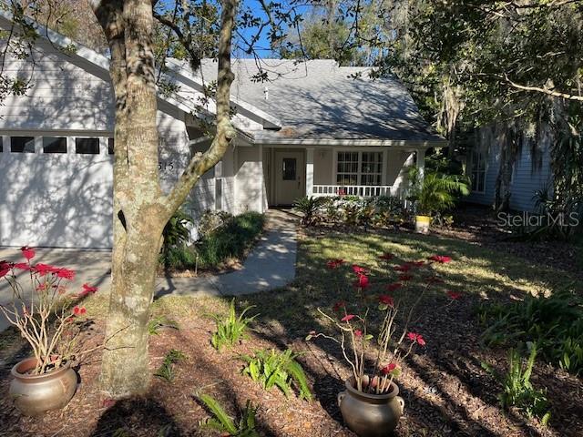 view of front of property featuring a garage and covered porch