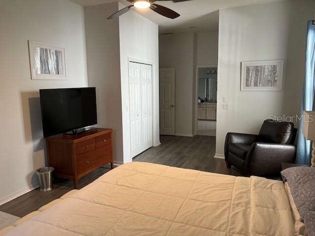 bedroom featuring ceiling fan and dark wood-type flooring