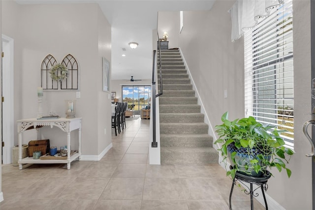 tiled entrance foyer with ceiling fan