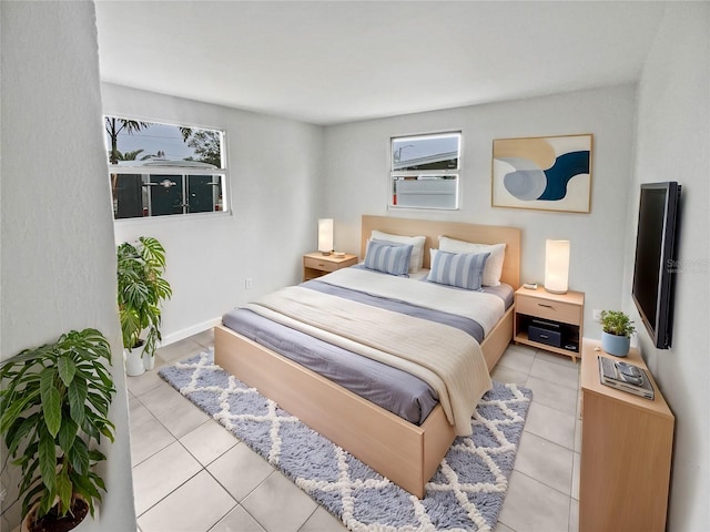 bedroom with light tile patterned flooring